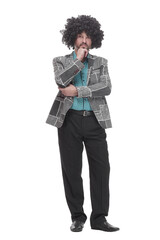 in full growth. cheerful man in a curly wig.