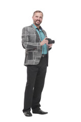 in full growth. smiling man with a camera.