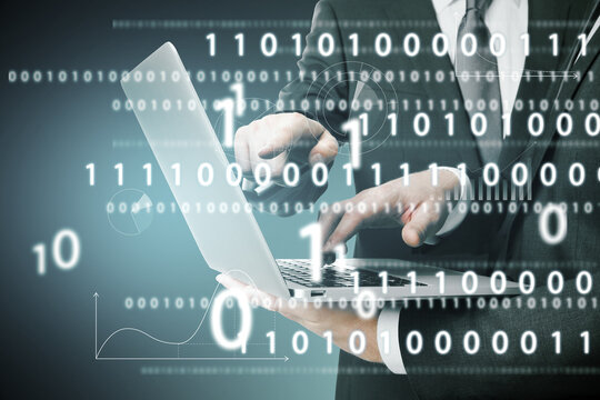 European businessmen pointing at laptop together with abstract glowing interface with binary code and business chart. Information, teamwork, technology and data concept. Close up. Double exposure.