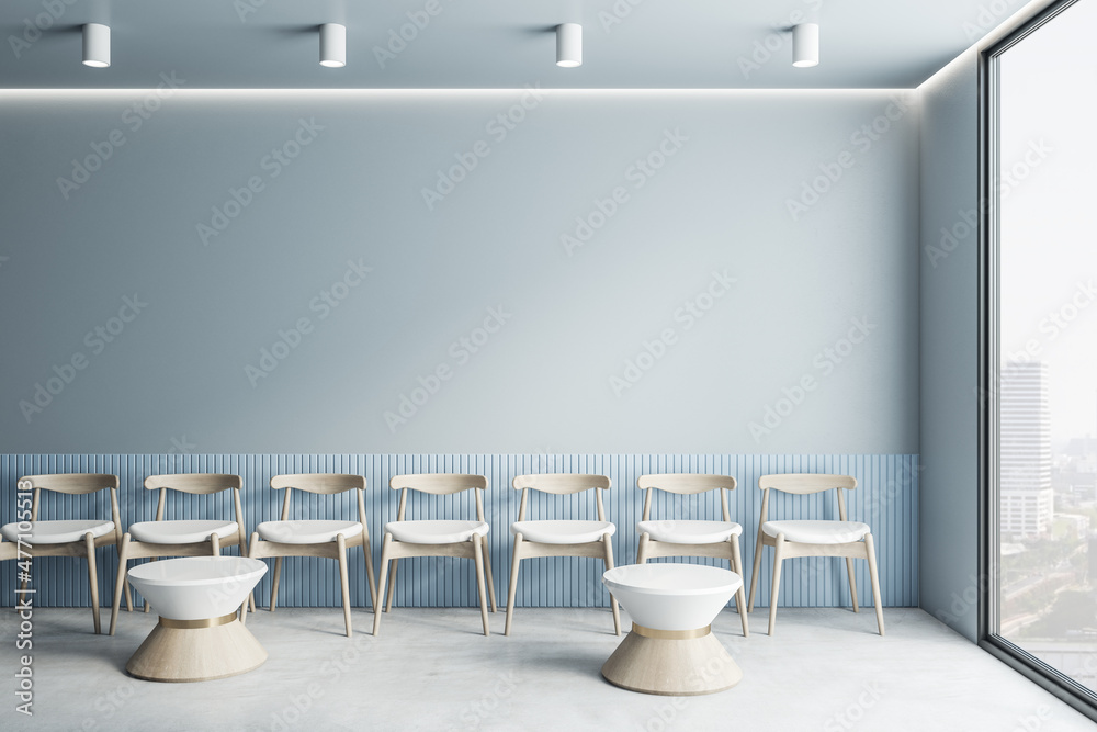Poster waiting area in office interior with mock up place on blue wall, chairs, tables and window with city