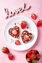 Breakfast for two, Valentines day food for couple in love with chocolate toasts and strawberry
