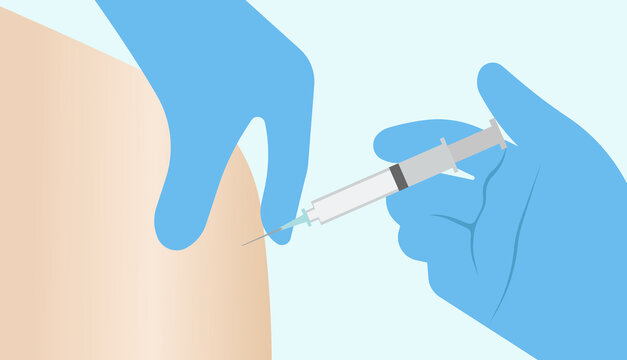 A doctors hand in a medical glove, vaccinating in the shoulder.