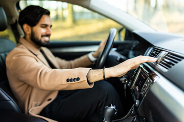 Indian Man Using Gps Navigation System In Car to travel.