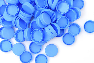 Plastic bottle caps isolated against a white background. 