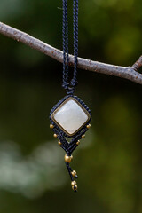 Boho necklace on natural background with moonstone
