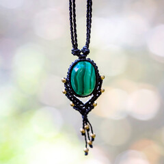 Boho necklace on natural background with green malachite stone