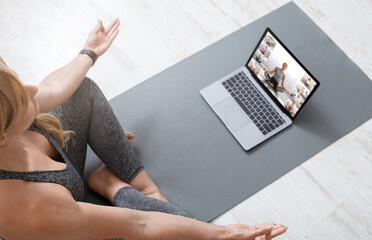 Online Training Concept. Fit Woman Making Yoga Via Group Conference With Instructor