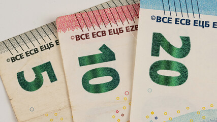 Close-up of five, ten and twenty euro bills.