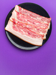 bacon strips meat slice thin slicing pork fat healthy meal diet snack on the table copy space food background rustic