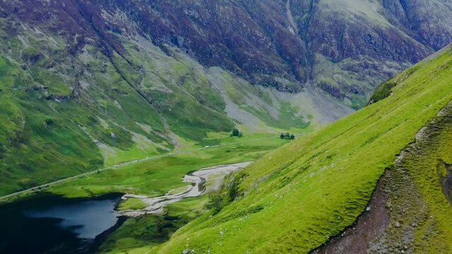 Aerial Drone Shot of Road Through the Glen Coe Hills 01. High quality video footage
