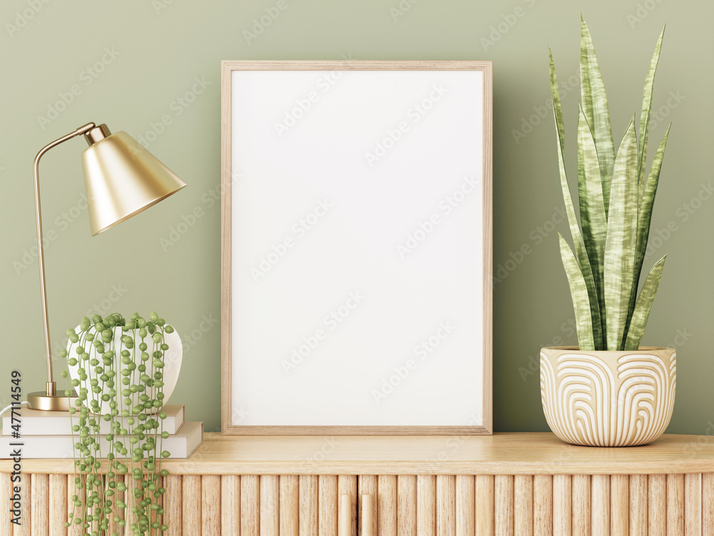 Fototapete Vertical empty frame mockup in green interior with slat sideboard, brass desk lamp and trendy plants in pots on empty wall background. 3D rendering, illustration