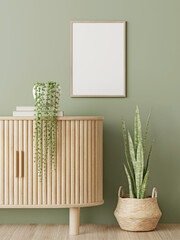 Poster mockup with vertical wooden frame hanging on olive green wall near curved slat sideboard with trendy green plants and basket. 3D rendering, illustration