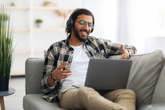 Handsome Arab Guy Reclining On Couch In Living Room