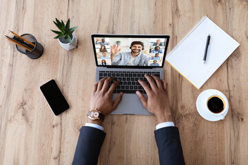 Unrecognizable Black Businessman Having Video Call On Laptop With Multiethnic Colleagues