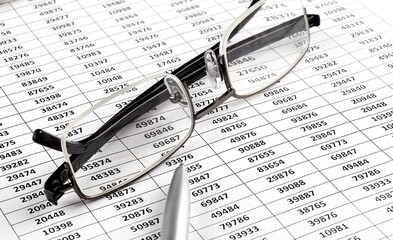 Business chart, pen and glasses. Business concept