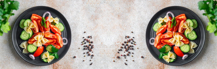 pasta salad no meat tomato, cucumber, farfalle, healthy meal diet snack on the table copy space food background rustic