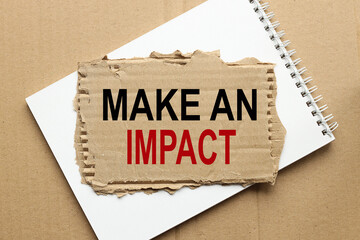 make an impact. text on torn paper on dark background