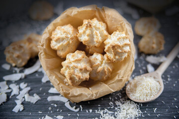 Coconut cookies macarons with on a dark background closeup