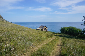 Fototapeta na wymiar A lonely hut on the coast of Olkhon Island