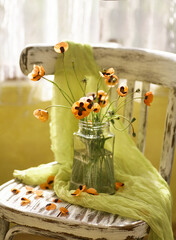 A Little Red Poppies Bouquet Arranged In Classical Style Stillife of popies in a glasses vase on vintage hair