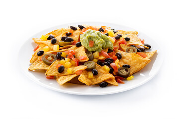 Mexican nachos tortilla chips with black beans, guacamole, tomato and jalapeno isolated on white background