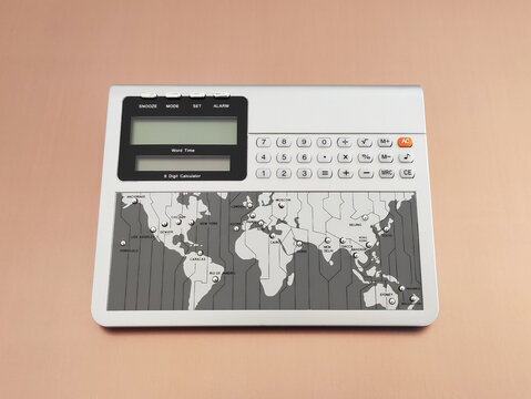 Calculator and world time display device - Powered by Adobe