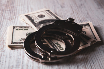 handcuffs and money on the table