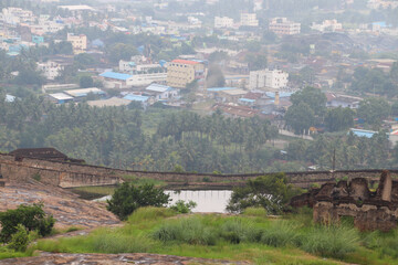 view of a south indian city from a rocky hill on a bright day