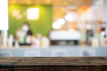 image of wooden table in front of abstract blurred background