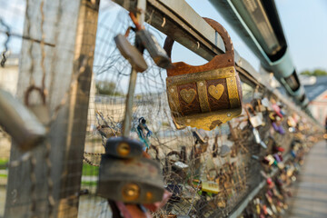 Bridge of lovers with hanging padlocks