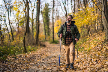 Fototapeta premium Image of man enjoys hiking in nature. 