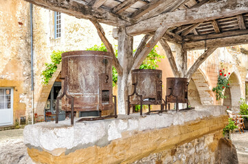 Market hall with old sizes for grain. 
Monpazier.  The most beautiful fortified town of the...