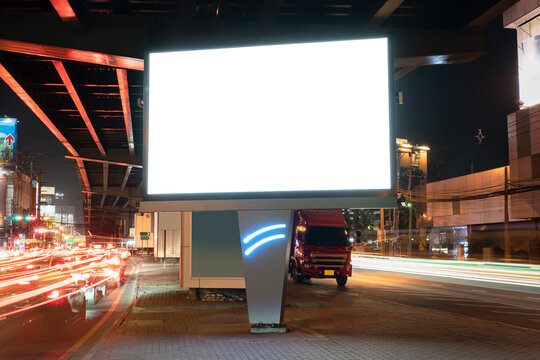 Blank billboard on light trails, street and urban in the night