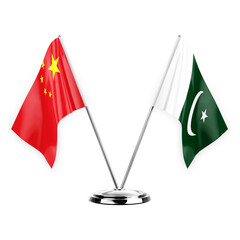 Two table flags isolated on white background 3d illustration, china and pakistan