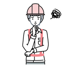 Fototapeta premium 立って手をあごにあてて困っている工事現場の女性