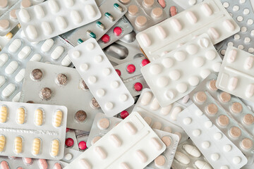 Background of a large group of assorted capsules and pills