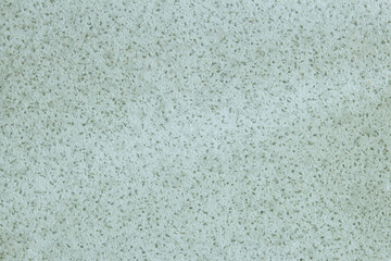 Obraz premium Weathered asymmetrical textured tile and some small white spots and dirt. Abstract background.
