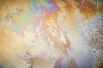 Oil stain on Asphalt, color Gasoline fuel spots on Asphalt Road as Texture or Background