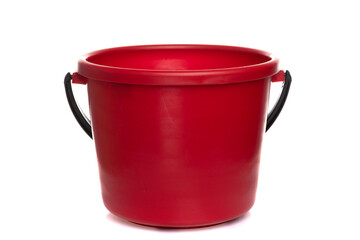 empty red plastic bucket with black handle on white isolated background - obrazy, fototapety, plakaty