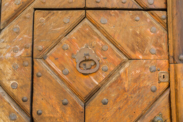 Old door with an interesting ornament, close-up.