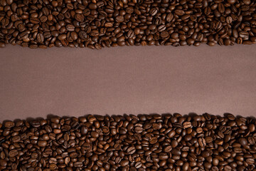 Tape, like road made of caffee beans. Brown background.