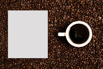 Creative layout made of coffee beans. Coffee card. Coffee background with paper card note on left side. Cup of coffee