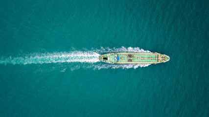 Oil ship tanker full speed with beautiful wave and splash water in line of transportation from...