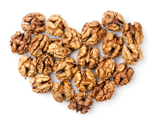 Walnuts kernels lined with hearts on a white background. Top view