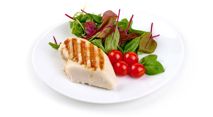 Grilled chicken breast served with mix salad, isolated on white background.