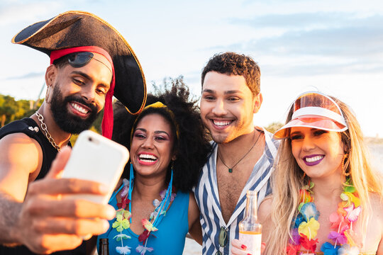 Carnaval in Brasil, happy friends together take selfie at brazilian party in costume.