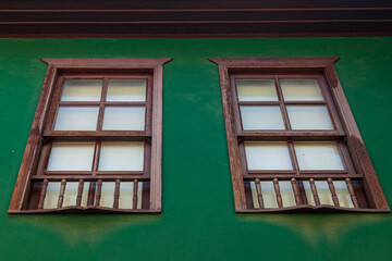 Window of old building close up. Traditional Ottoman style wooden architecture. Historical building at turkish town