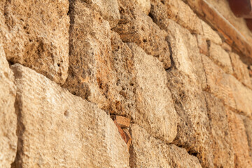 Stone wall texture background - grey stone siding with different sized stones.