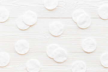 Fototapeta na wymiar Cleansing skin supplies - cotton pads pattern, top view