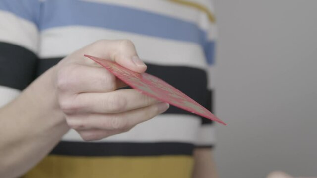 Close Up Shot of Hand Giving Chinese New Year Red Envelope to Person . High quality video footage